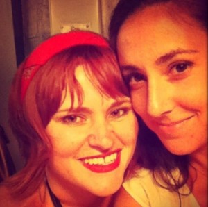 Kelly Lewis smiling with a friend, wearing a red headband, featured in the Go! Girl Guides article on empowering women to travel