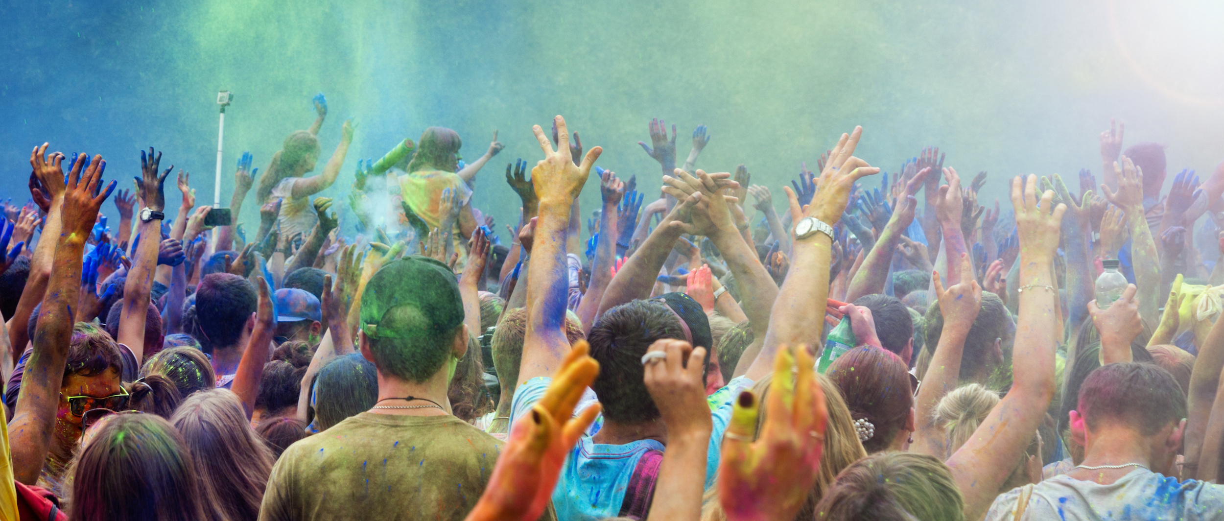Holi Festival | Abroad101 Blog Celebrants dancing during the color Holi Festival