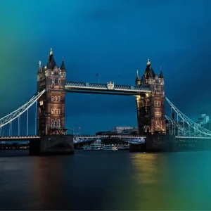 The Intern Group - London Internship Placement Program photo | Abroad101 Blog The iconic Tower Bridge in London illuminated at dusk, with the city lights reflecting on the Thames River, symbolizing the connection and opportunities available through The Intern Group's London Internship Placement Program.