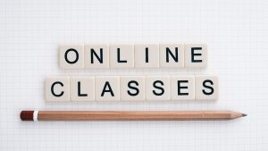 online-classes-5556840_1280 | Abroad101 Blog Scrabble tiles spelling'Online Classes' next to a pencil, symbolizing flexible and accessible online summer learning.