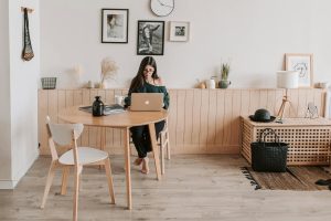 pexels-vlada-karpovich-4050424 | Abroad101 Blog Student using a laptop in a cozy, minimalist apartment dining area—capturing the independence of off-campus study-abroad housing.