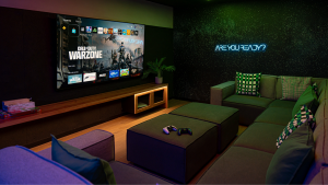 COMMON AREA-16 (1) | Abroad101 Blog Gaming lounge at Blau Student Housing with big-screen TV, comfy modular sofas, and controllers—space for students to relax and connect.