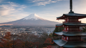 Cultural immersion in Japan | Abroad101 Blog AI-generated 16:9 image of Mount Fuji, a traditional Japanese pagoda and a town below, representing cultural immersion in Japan.
