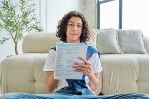 Canada Study Permit forInternational Students | Abroad101 Blog International student reviewing documents while preparing a Canadian study permit application